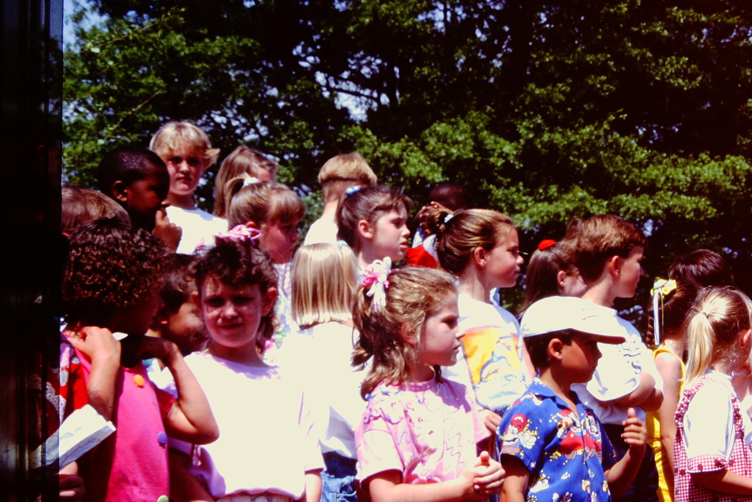 alt=Photo of children standing outside of the Anne Springs Close Greenway