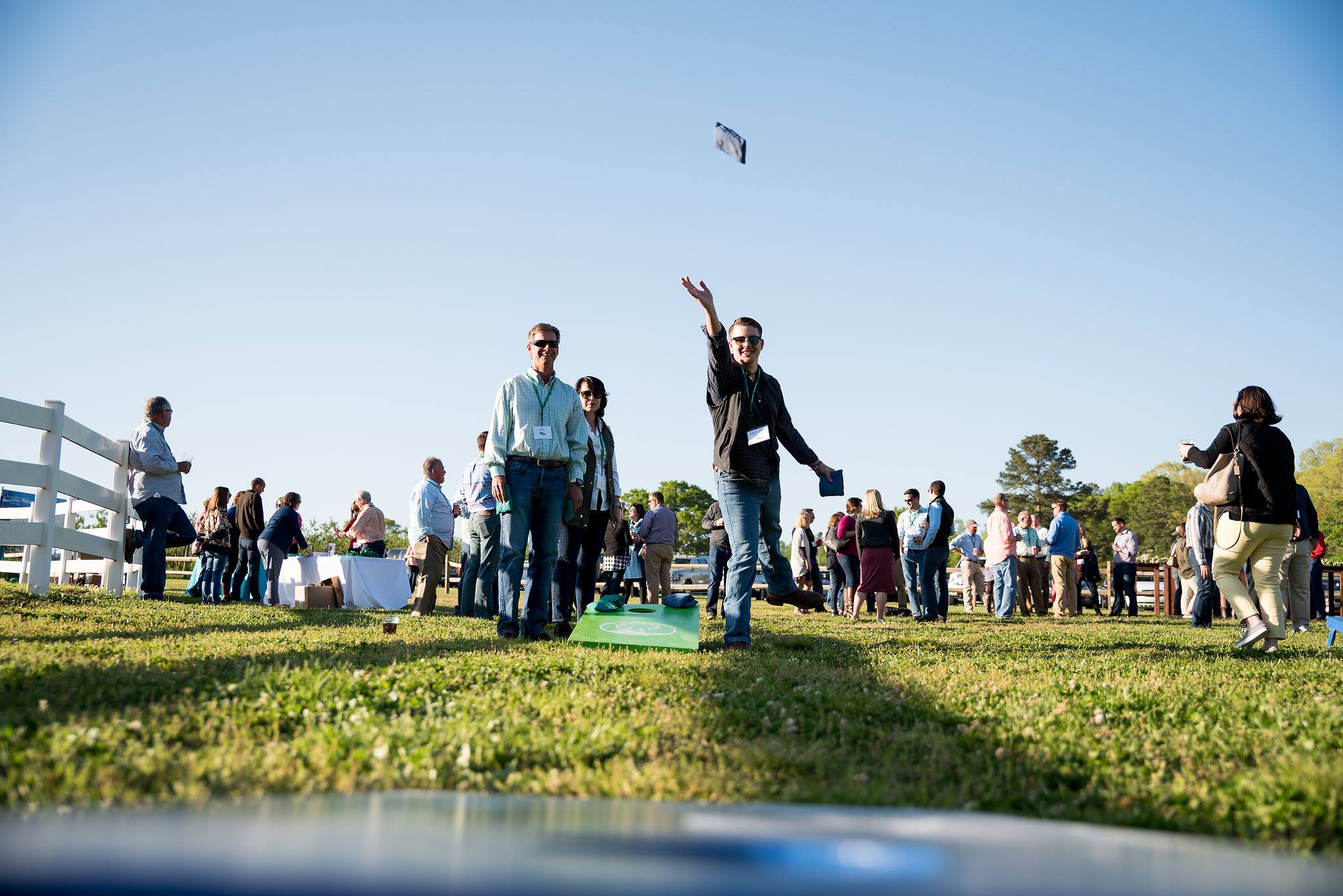People playing cornhole