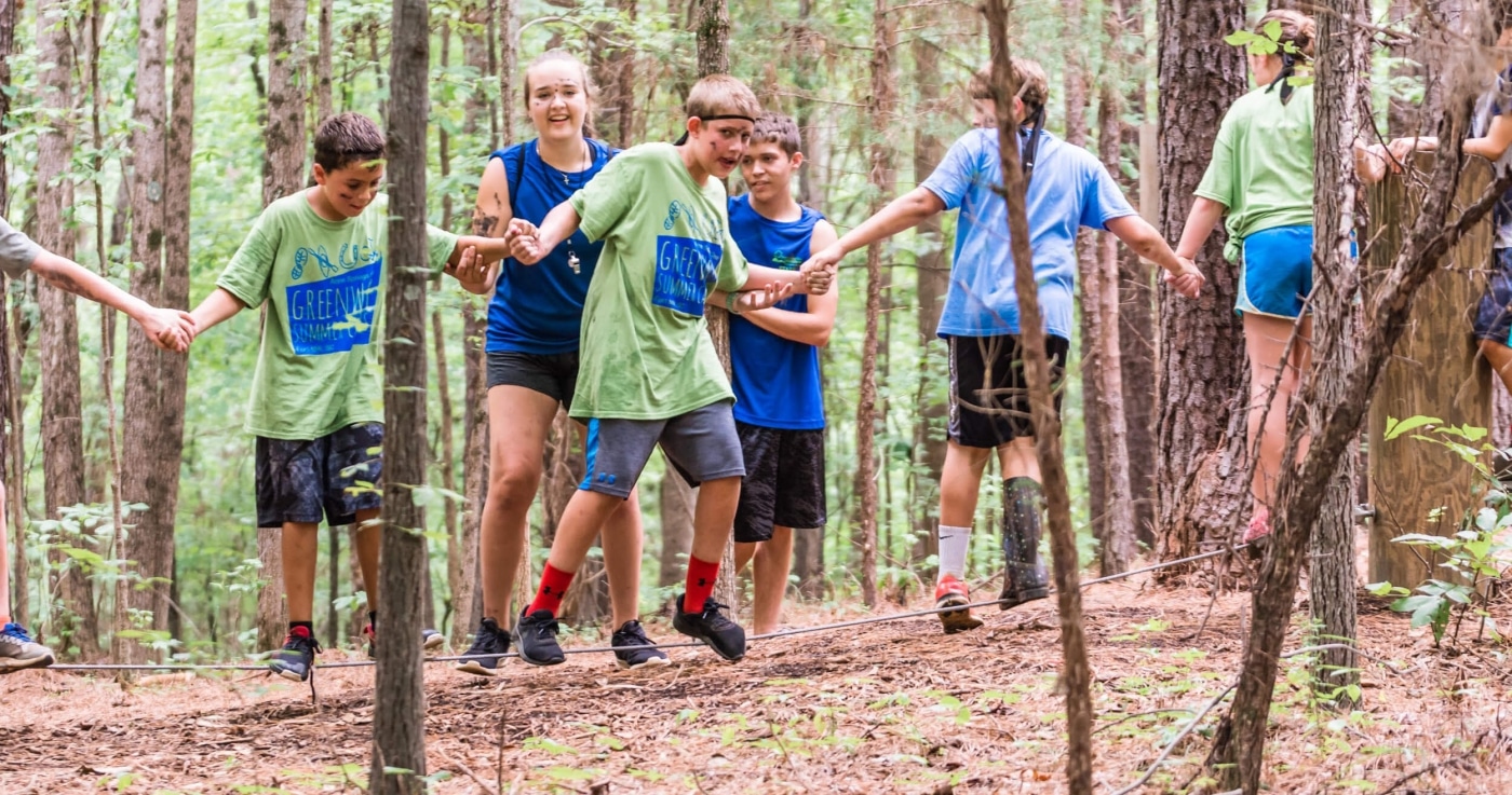 alt=Kids doing group interaction course