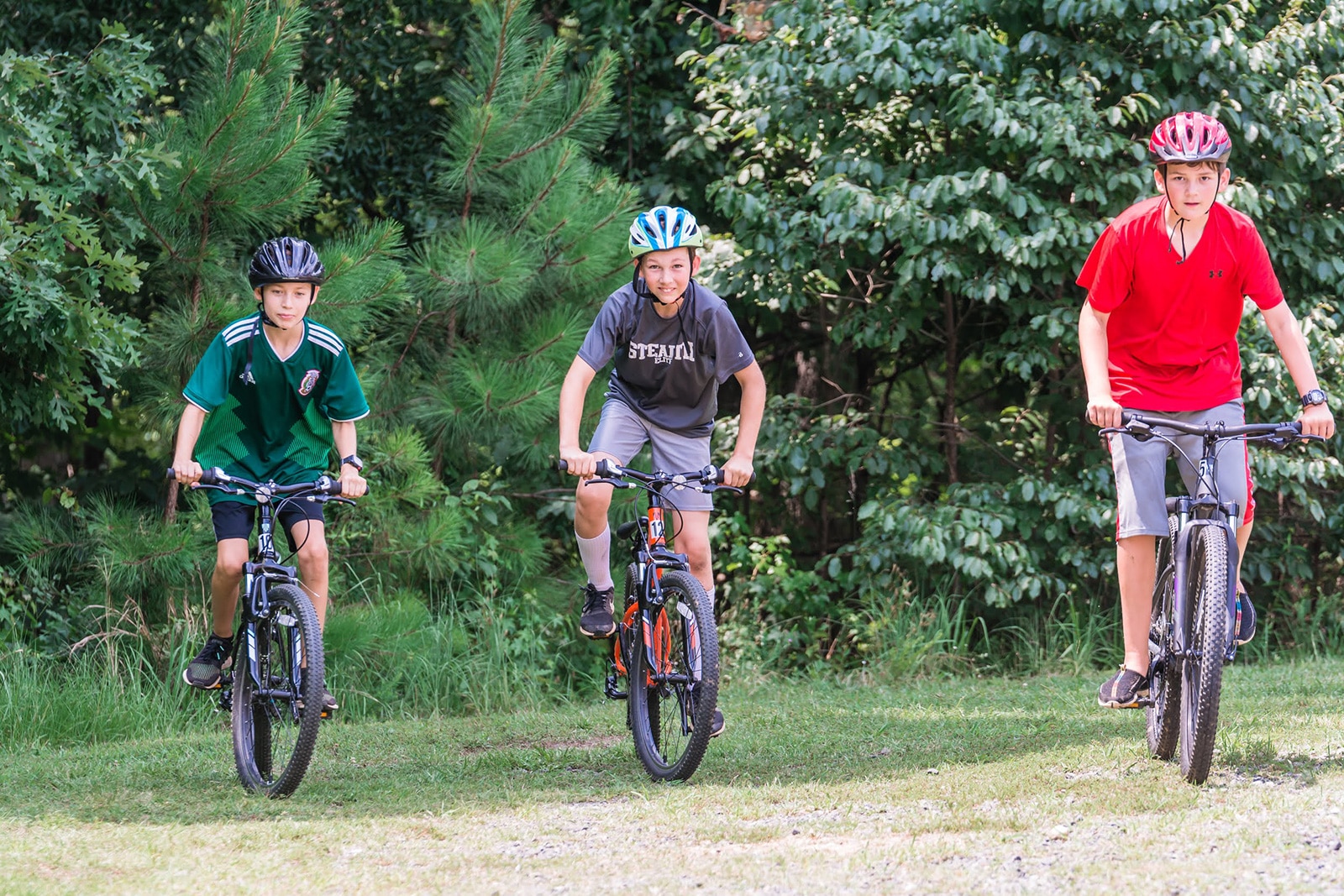 alt=Photo of 3 Boys Mountain Biking at the Anne Springs Close Greenway