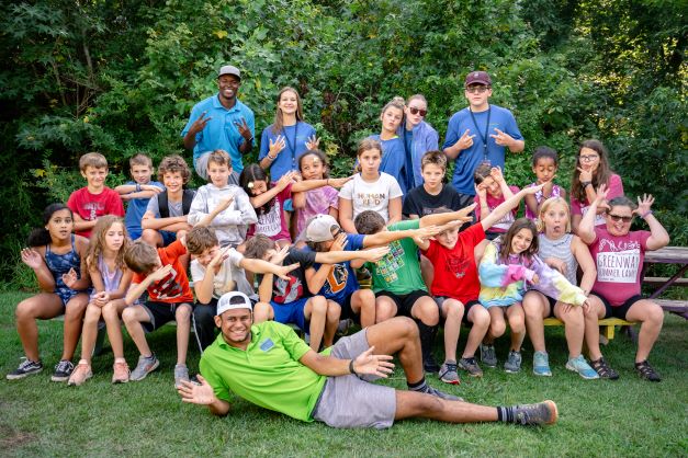 alt=Photo of Anne Springs Close Greenway's Summer Camp Counselors posing with summer campers