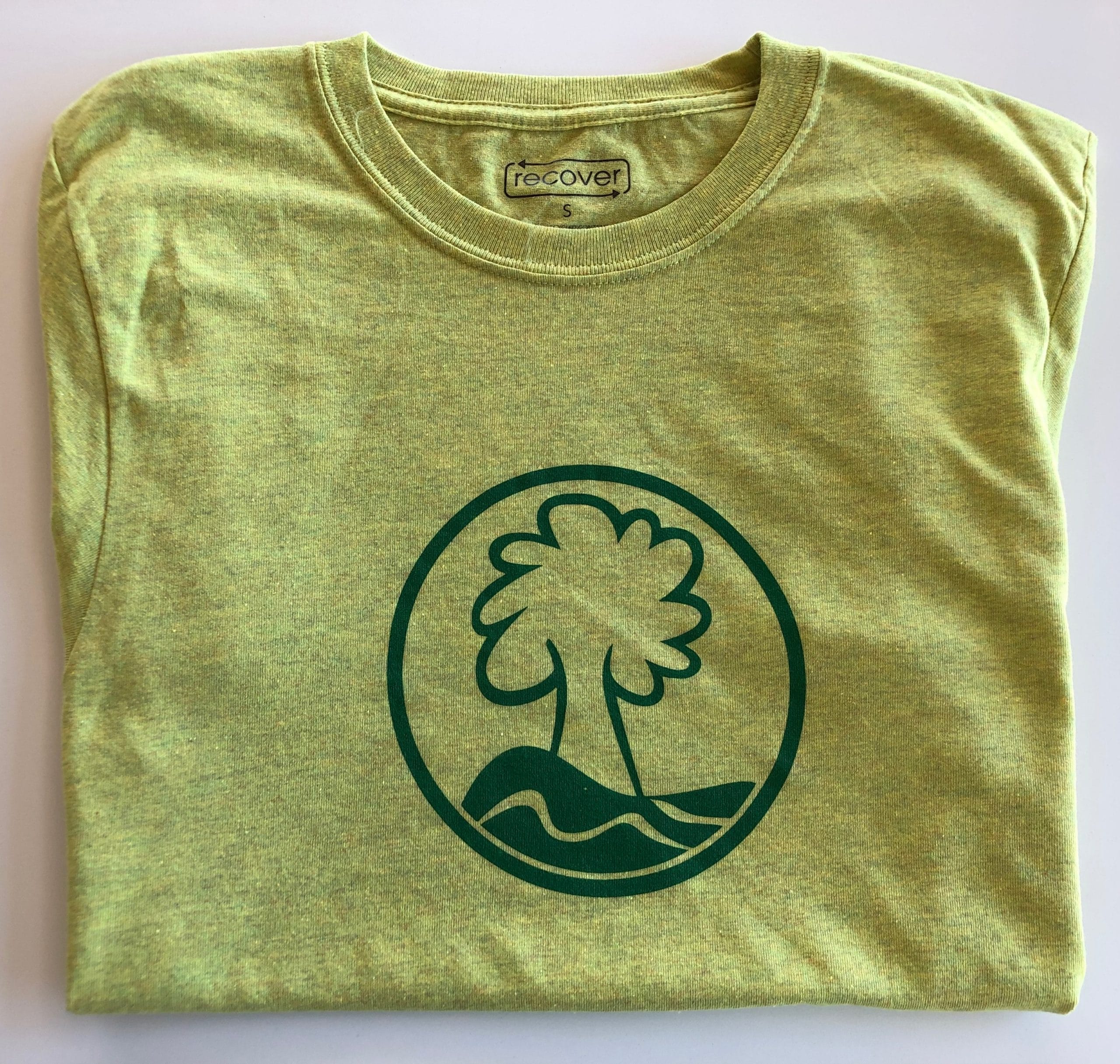 Photo of Anne Springs Close Greenway tree logo on a green t-shirt