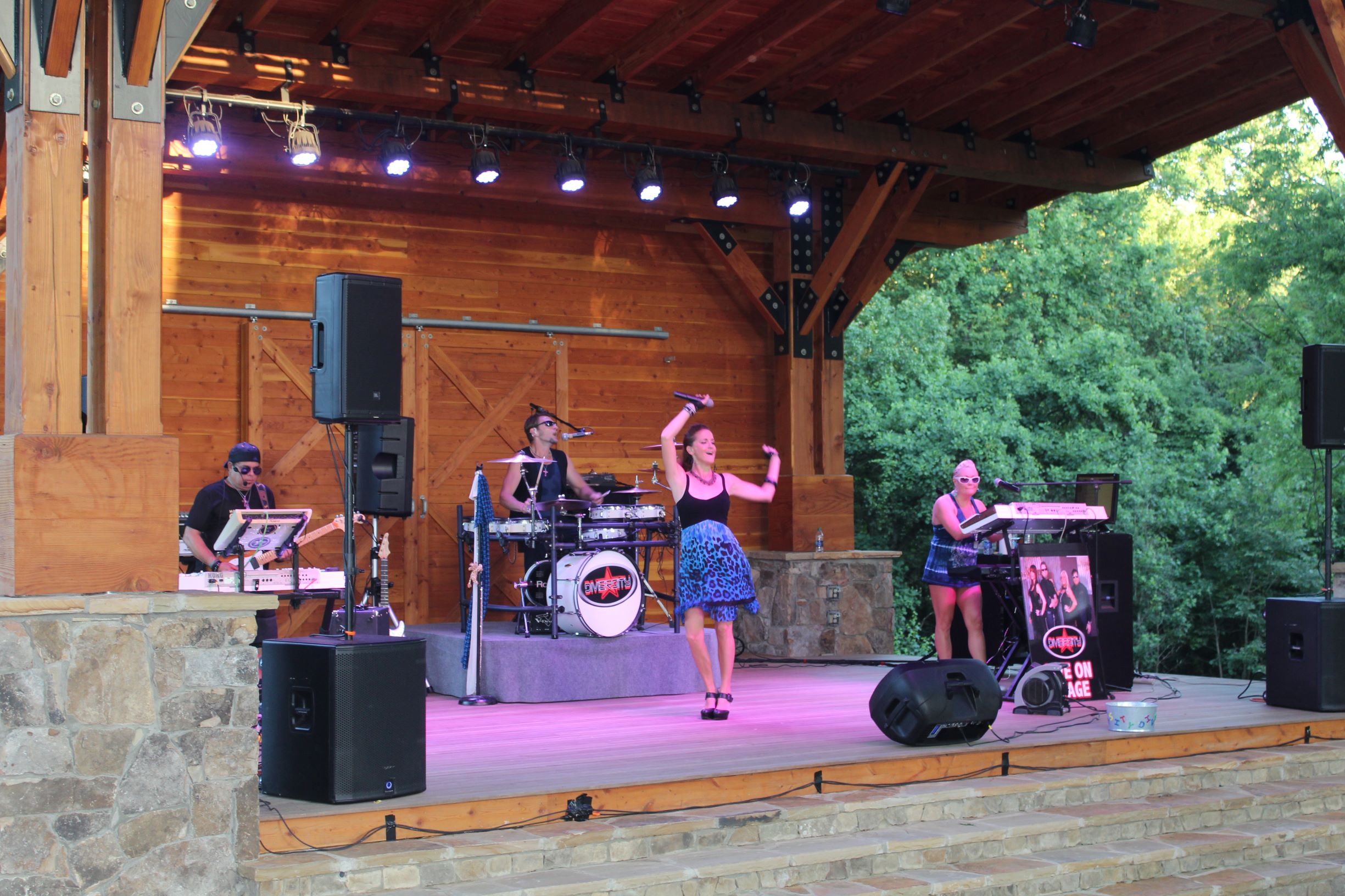 Photo of performer on stage at Anne Springs Close Greenway's Summer Concert Series