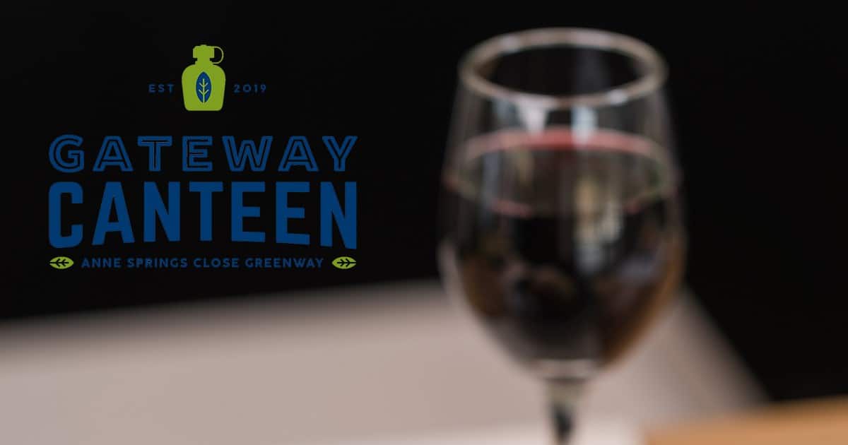 Logo of Gateway Canteen on top of a glass of wine