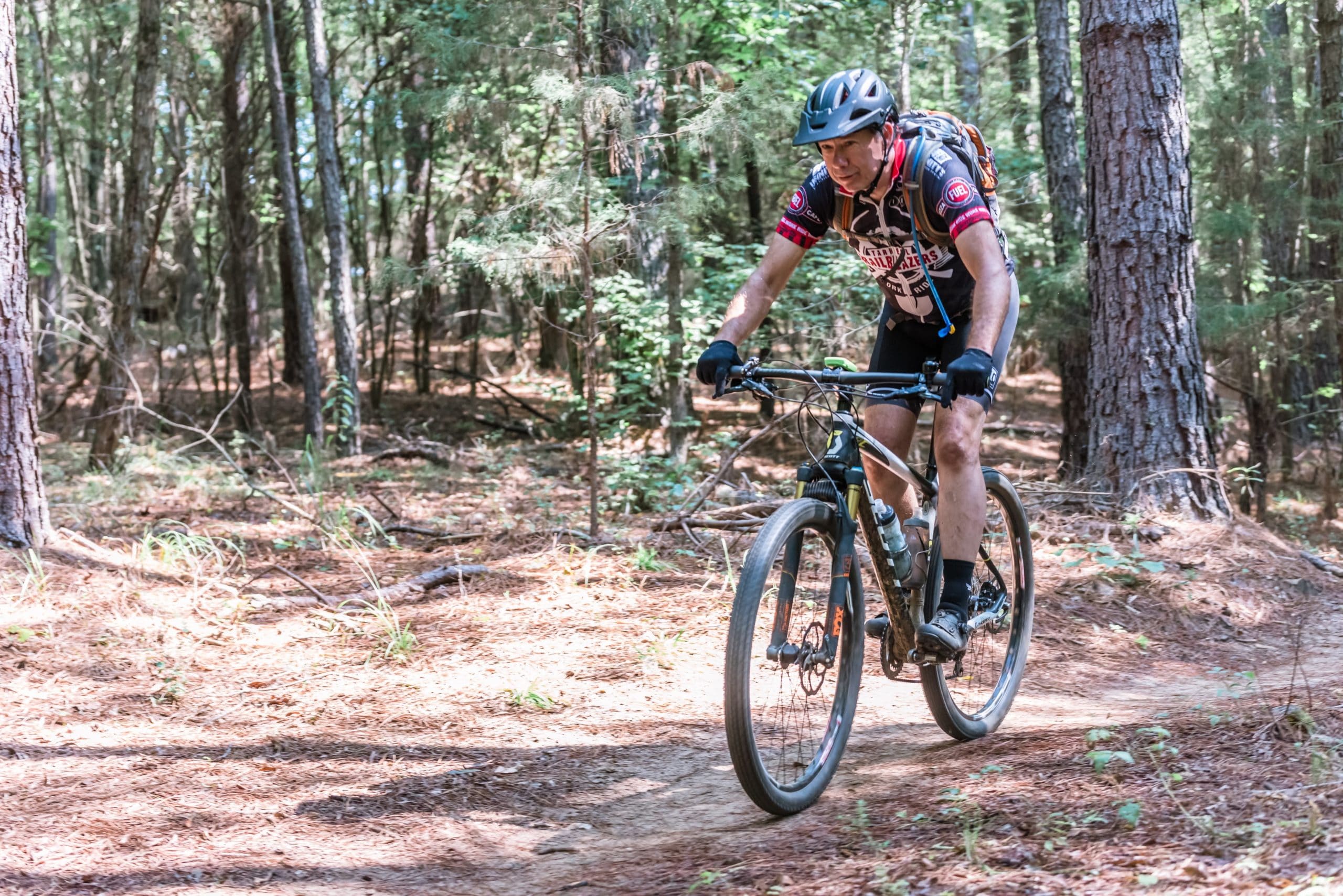Photo of man riding a mountain bike during the Anne Springs Close Greenway's Intermediate Mountain Bike Clinic