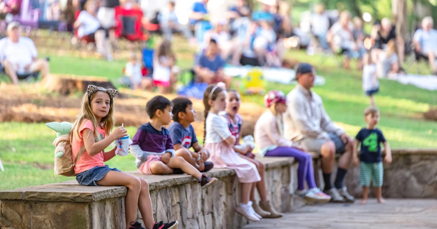 Kids at enjoying live music at the Comporium Amphitheater at the Anne Springs Close Greenway