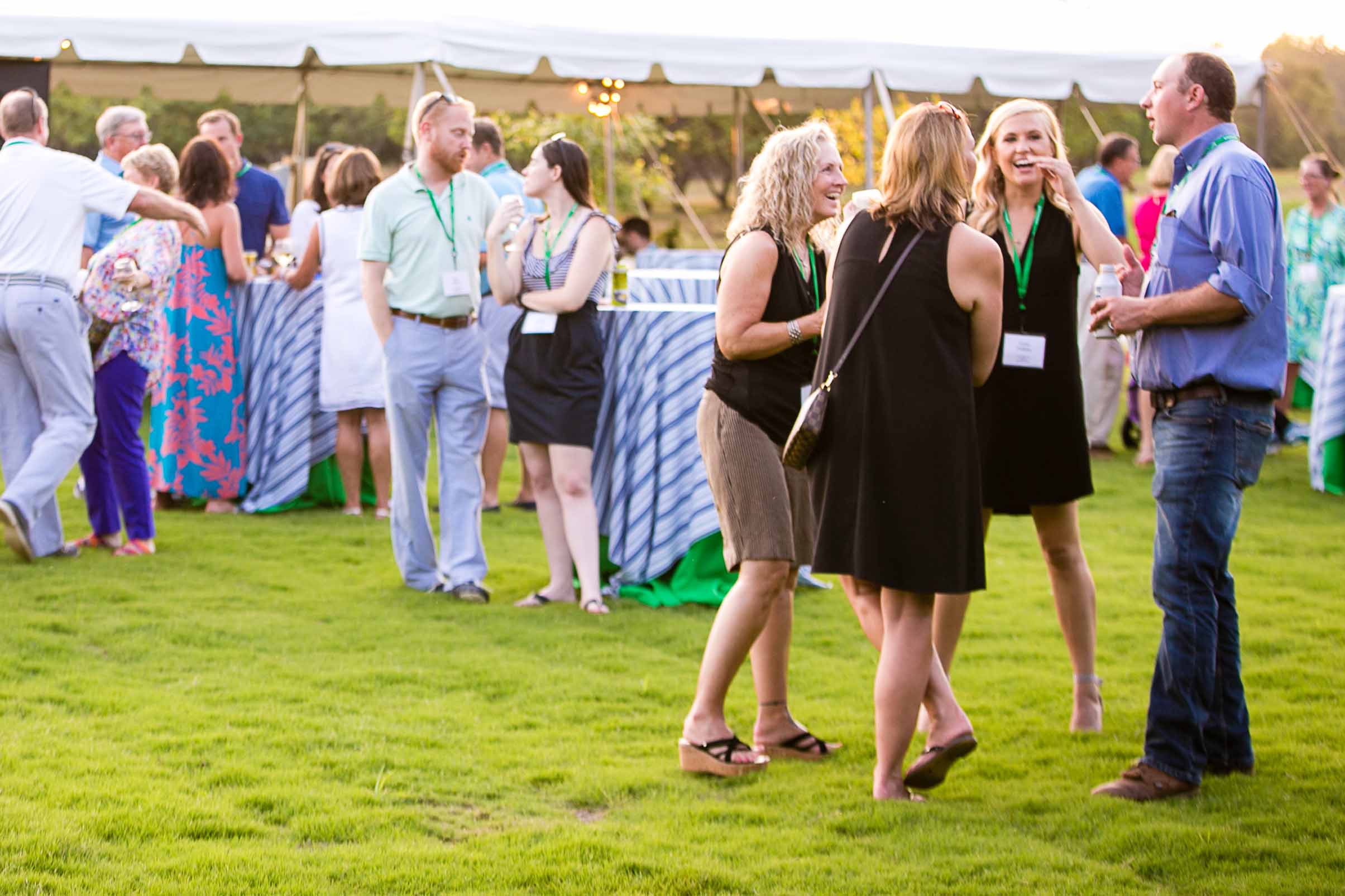 alt=Photo of a group of people laughing together at the Friends of the Greenway