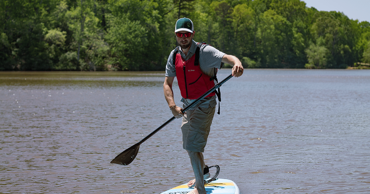 Photo of man paddleboarding at Lake Haigler at the Anne Springs Close Greenway
