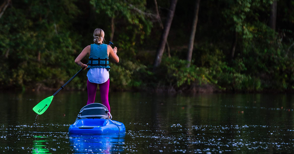 Photo of woman paddleboarding on Lake Haigler at the Anne Springs Close Greenway