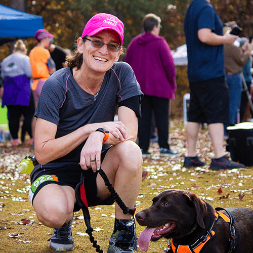 Contestant with her dog at the Springmaid Splash 5K Trail Race