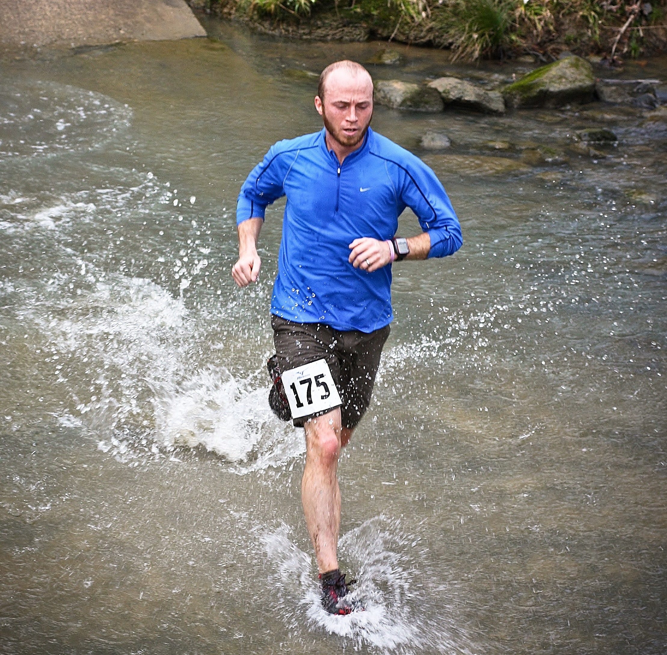 Contestant running in the Springmaid Splash 5K Trail Race