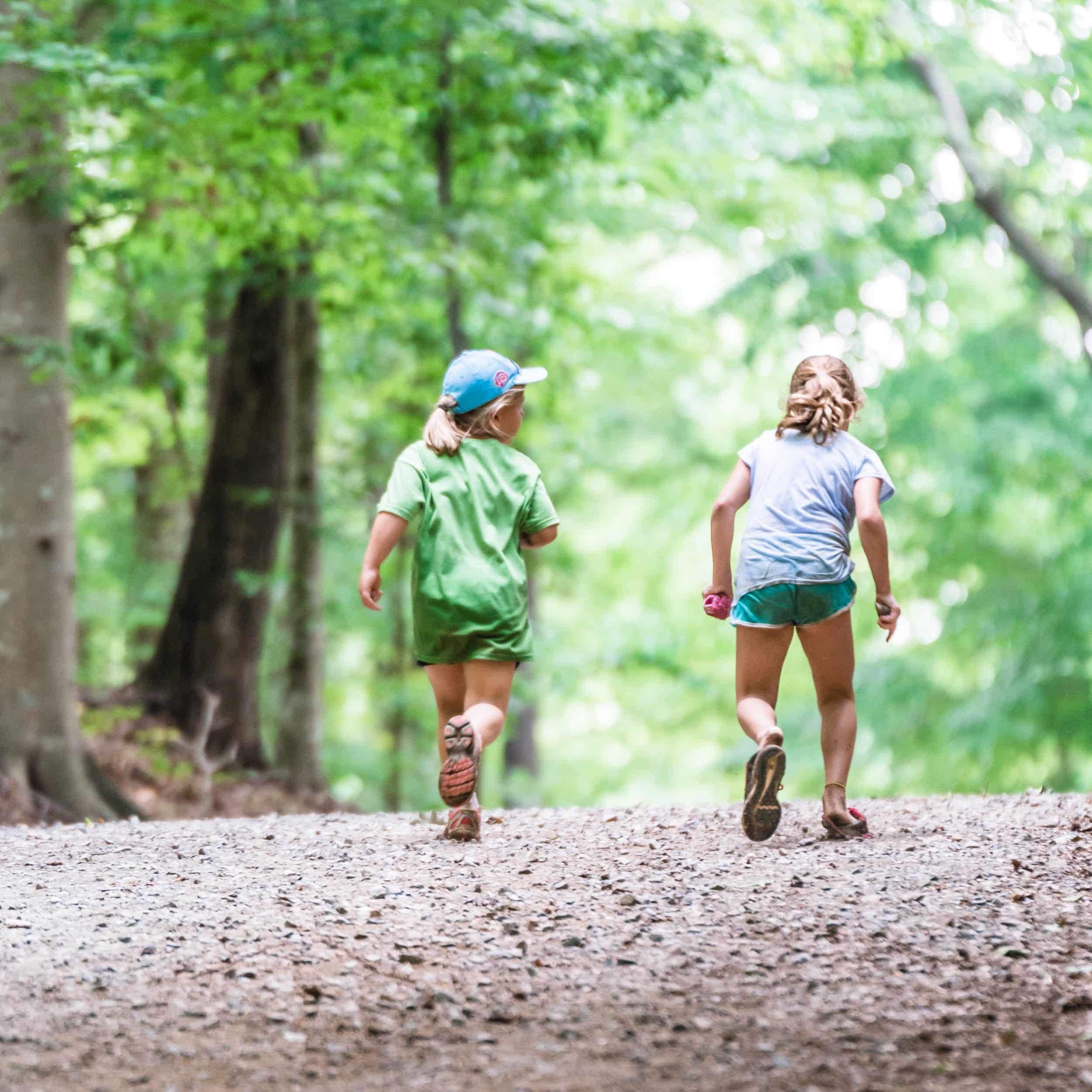 Photo of 2 young girls walking on a trail of the Anne Springs Close Greenway