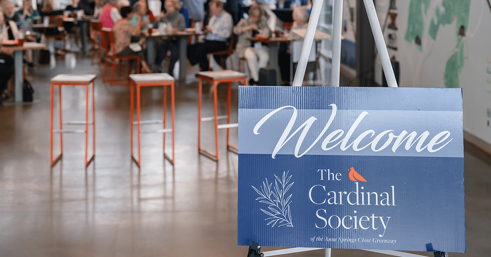 The Cardinal Society of the Anne Springs Close Greenway welcome sign at informational luncheon.