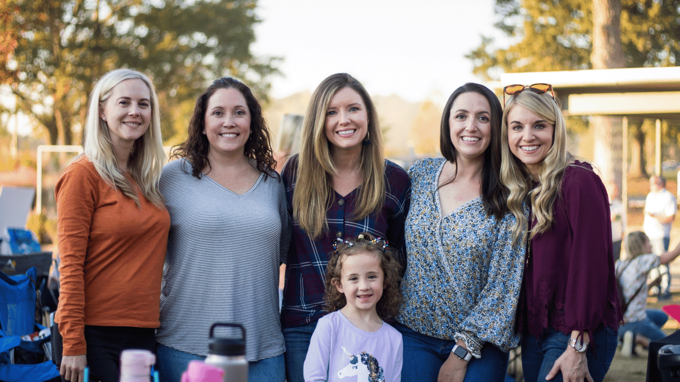 Five ladies and one young girl attend event outside at the Anne Springs Close Greenway