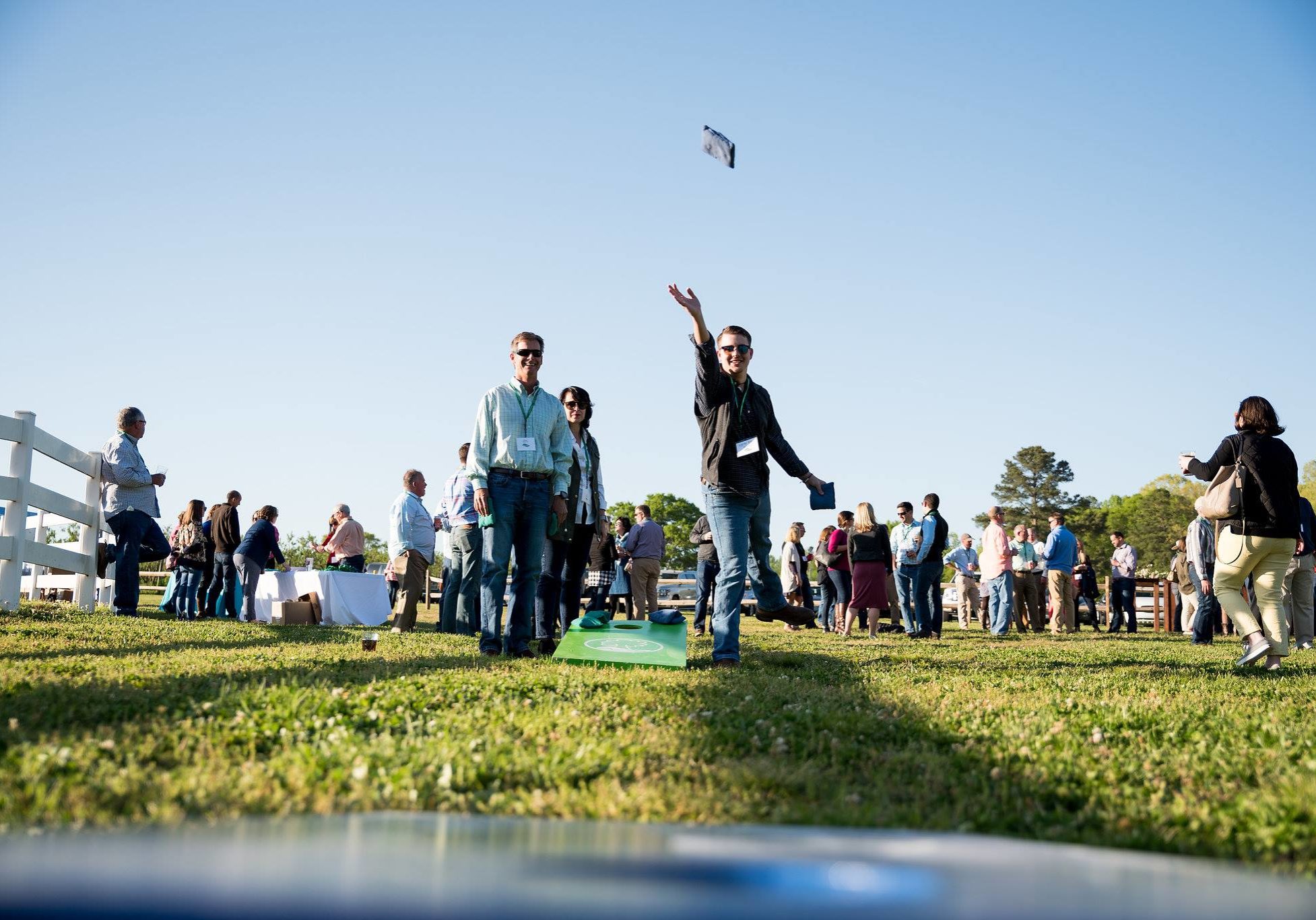 People playing cornhole