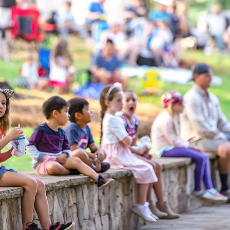 Kids at enjoying live music at the Comporium Amphitheater at the Anne Springs Close Greenway