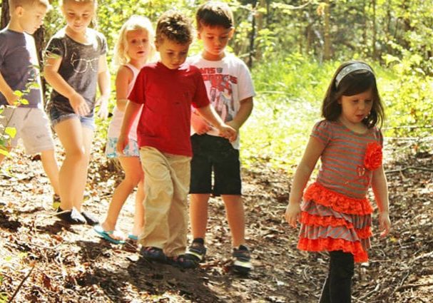 Kids walking a trail at outdoor preschool