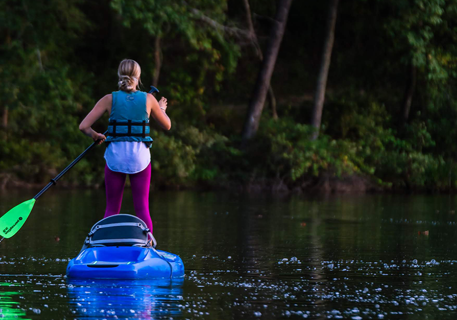Photo of woman paddleboarding on Lake Haigler at the Anne Springs Close Greenway